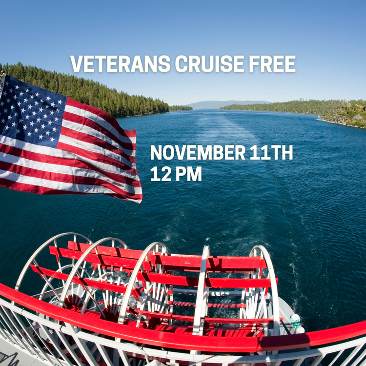 American flag displayed on the M.S. Dixie II paddlewheel boat as it cruises across Lake Tahoe, with forested shoreline views and text promoting a free Veterans Day cruise on November 11 at 12 PM.